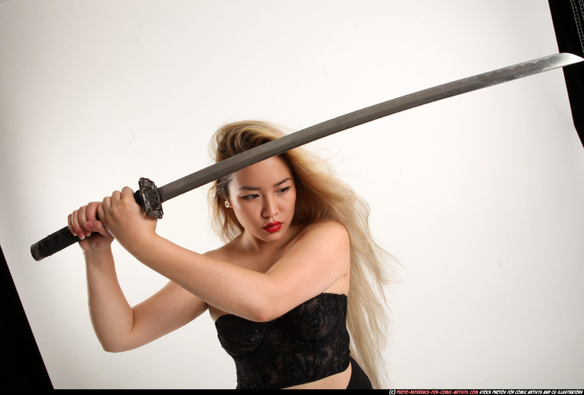 A woman of Asian descent with a katana